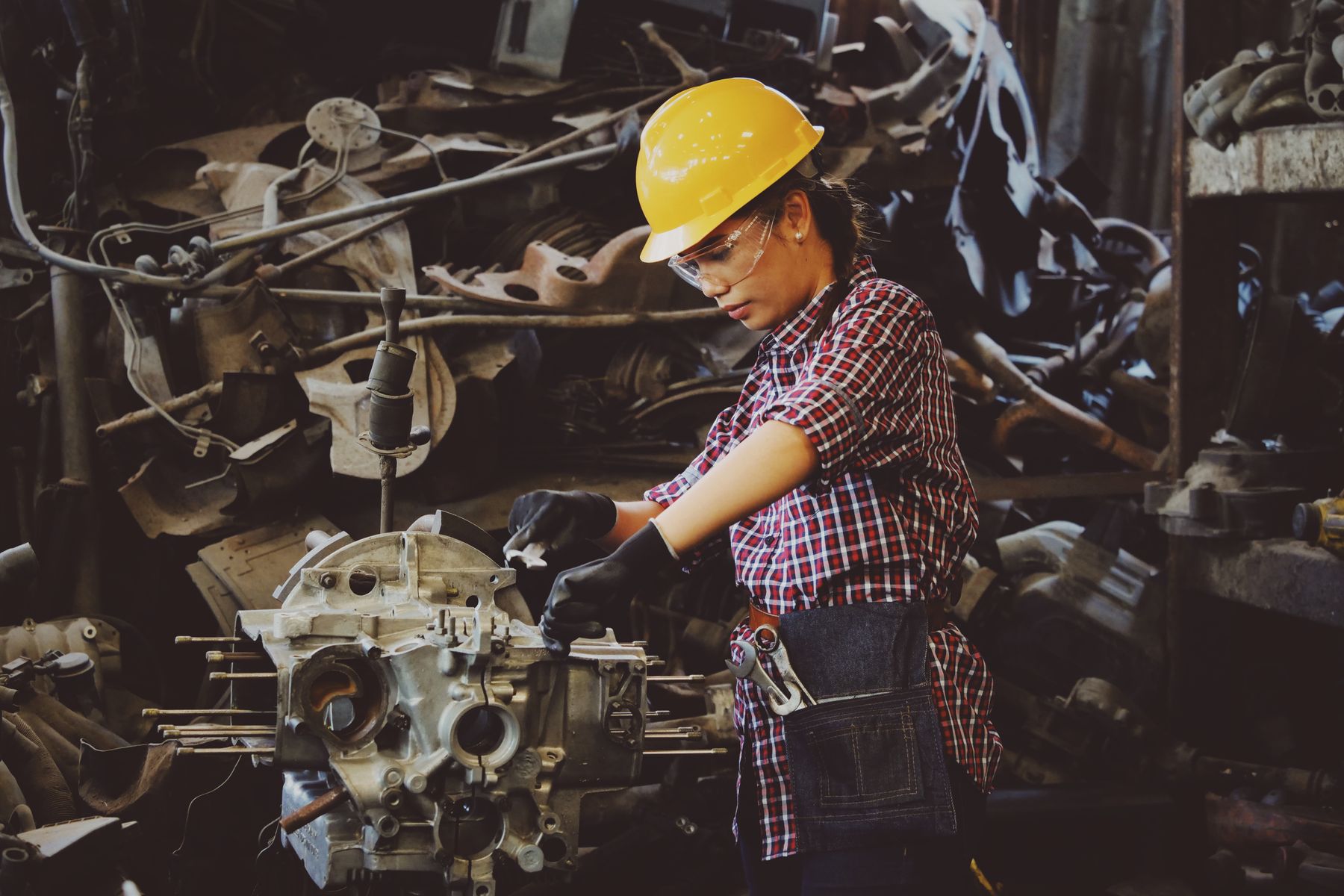 Technician performing hands-on industrial maintenance work